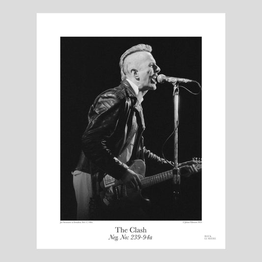 Joe Strummer onstage with The Clash at Isstadion, Sweden, Feb 17, 1984.  Photograph by Johan Ödmann. Rock Lumiere Editions offer beautiful Rock Photography Posters and Limited Edition Fine Art Prints.  Choose among unique b/w photographs of legendary artists and bands.  Rock, Classic Rock, Swedish Garage Rock, Heavy Metal, NWOBHM, Goth, Pop, Blues, Paisley Underground. Order today. Worldwide shipping.