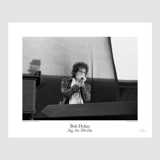 Bob Dylan performing at Ullevi, Sweden, Jun 09, 1984 , shot by Johan Ödmann. Original film negative digital printed using archival pigment ink on archival cotton based paper.  Rock Lumiere Editions offer beautiful Rock Photography Posters and Limited Edition Fine Art Prints in different sizes. Choose among unique b/w photographs of legendary artists. Rock, Classic Rock, Heavy Metal, NWOBHM, Goth, Pop, Blues, Paisley Underground. Order your favorite music photography today. Worldwide shipping.