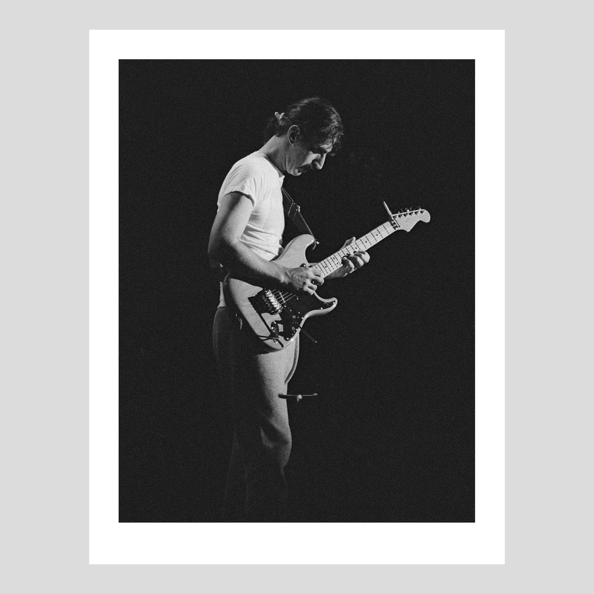 Frank Zappa onstage at Isstadion, Sweden, Sep 14, 1984. Photograph by Johan Ödmann.  Rock Lumiere Editions offer beautiful Rock Photography Posters and Limited Edition Fine Art Prints.  Choose among unique b/w photographs of legendary artists: Rock, Classic Rock, Swedish Garage Rock, Heavy Metal, NWOBHM, Goth, Pop, Blues, Paisley Underground. Order your favorite music photography today. Worldwide shipping.