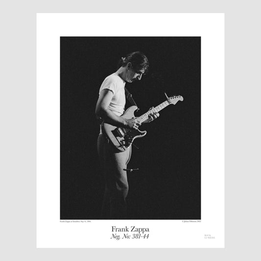 Frank Zappa onstage at Isstadion, Sweden, Sep 14, 1984, shot by Johan Ödmann. Original film negative digital printed using archival pigment ink on archival cotton based paper.  Rock Lumiere Editions offer beautiful Rock Photography Posters and Limited Edition Fine Art Prints in different sizes. Order your favorite  music photography today. Worldwide shipping.