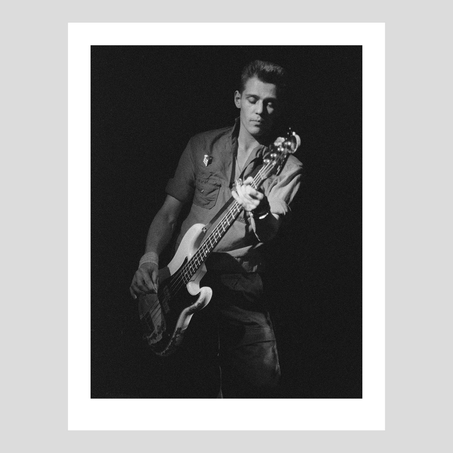 Paul Simonon with his battered iconic Fender bass on stage with The Clash at Isstadion, Sweden, Feb 17, 1984. Photograph by Johan Ödmann. Rock Lumiere Editions offer beautiful Rock Photography Posters and Limited Edition Fine Art Prints of iconic artists and bands. Order today. Worldwide shipping.