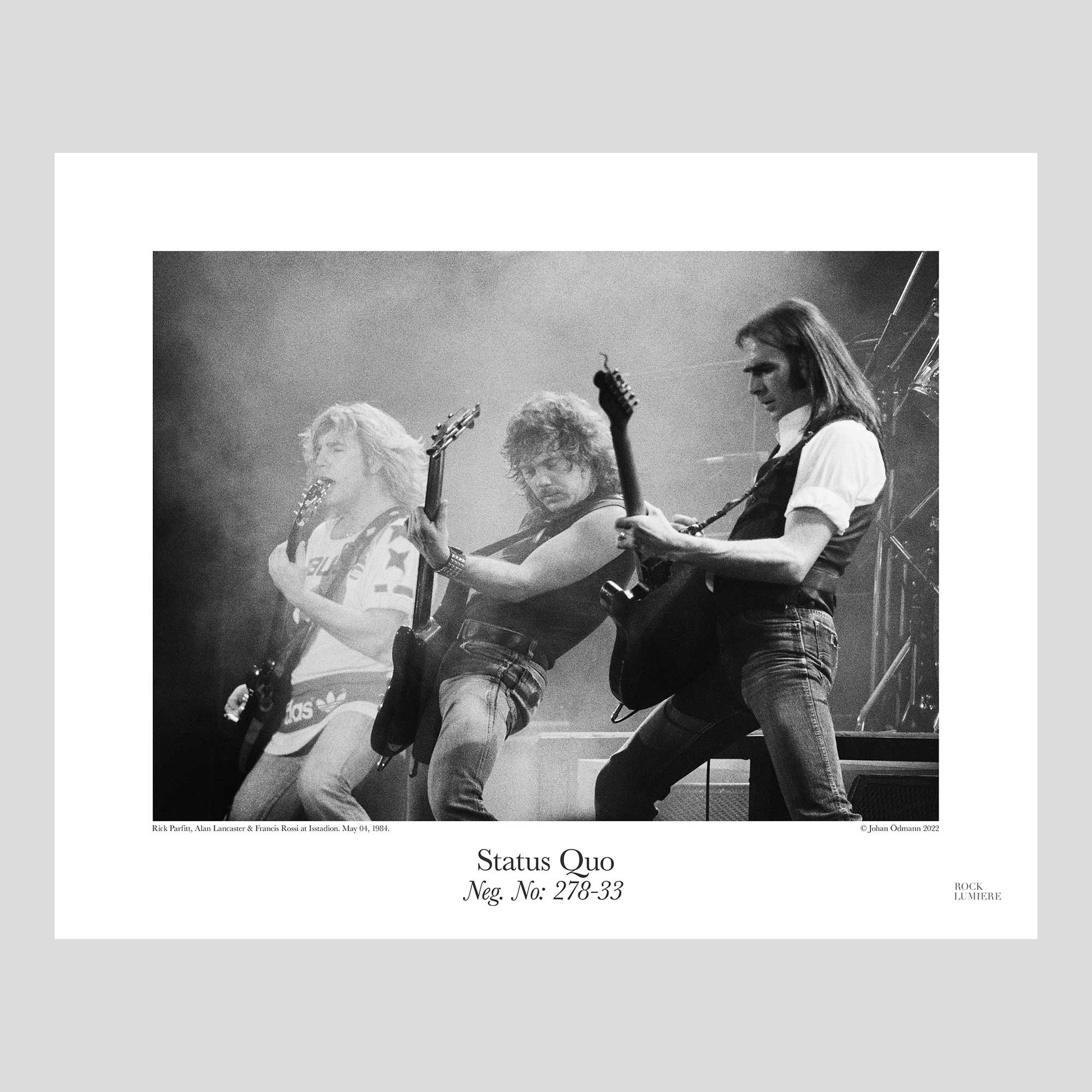 Status Quo with Rick Parfitt, Alan Lancaster & Francis Rossi on stage at Isstadion, Sweden, May 04, 1984. Photography by Johan Ödmann. Rock Lumiere Editions offer beautiful Rock Photography Posters and Limited Edition Fine Art Prints.  Choose among unique b/w photographs of legendary artists and bands.  Rock, Classic Rock, Swedish Garage Rock, Heavy Metal, NWOBHM, Goth, Pop, Blues, Paisley Underground. Order today. Worldwide shipping.